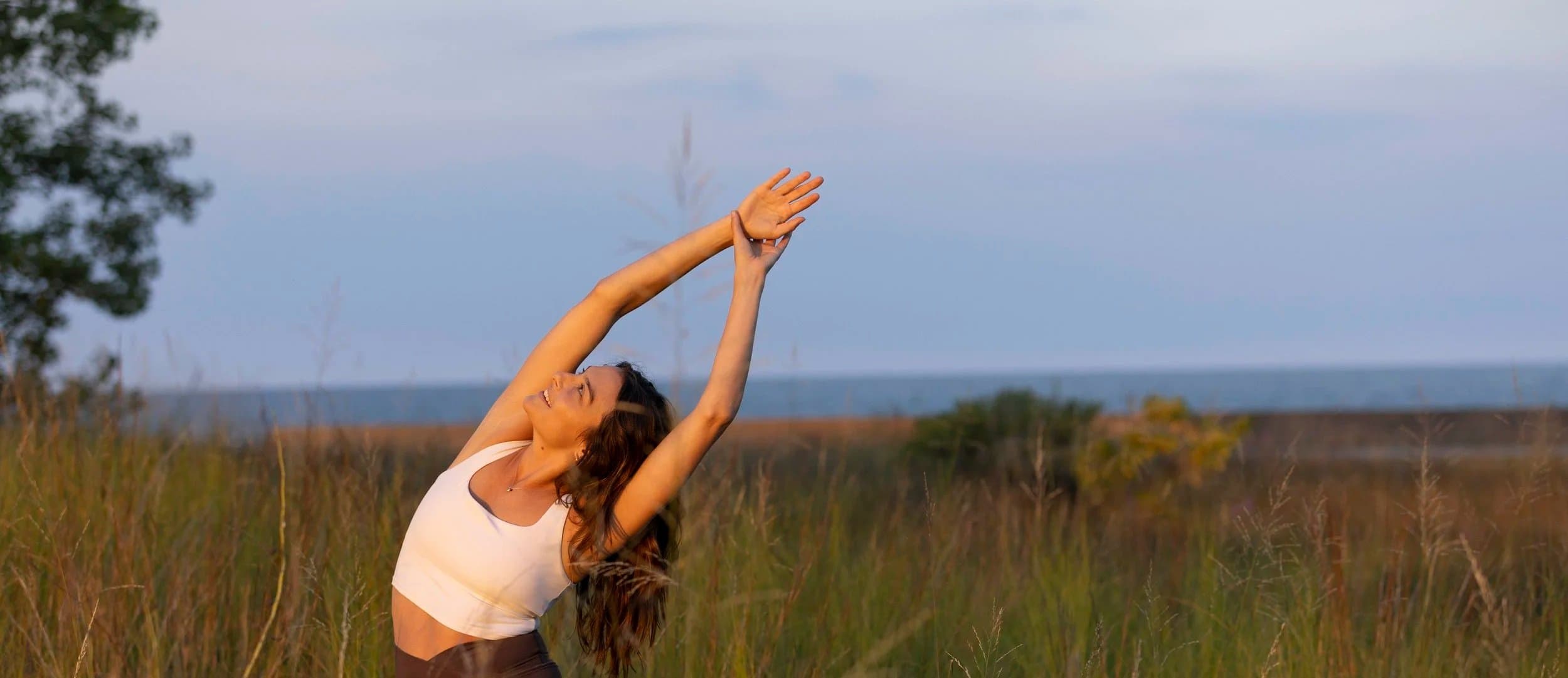 Ali stretching at the lakeshore